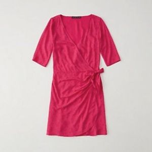 Bright pink dress with dots and faux wrap skirt